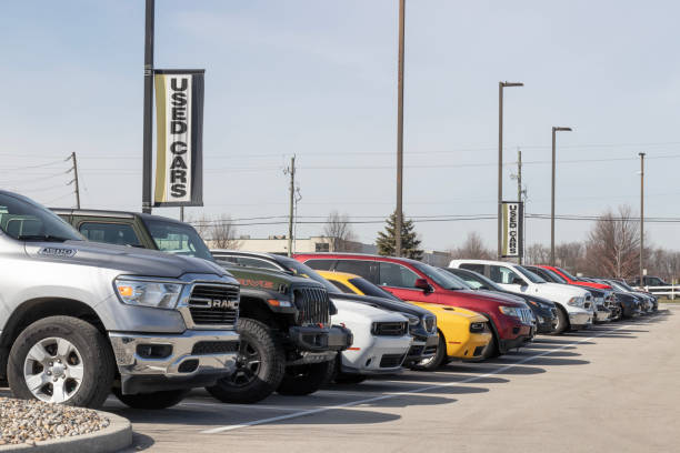 Row of used cars at a dealership lot — AutoRomandie buys your car across Suisse Romande